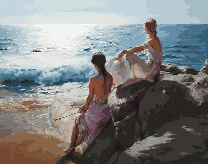 Mujeres Sentadas sobre Rocas de Playa Pintar por Números