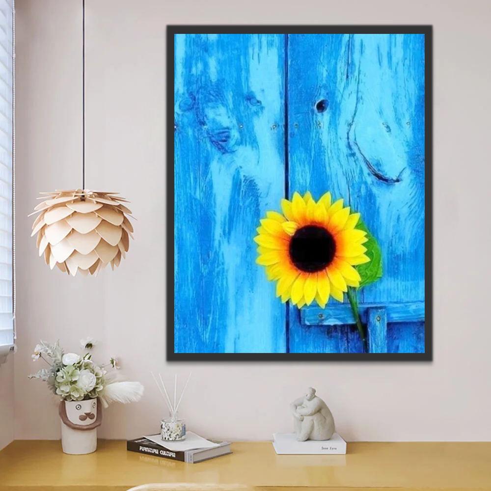 Un Girasol con Fondo de Textura de Madera Azul Pintar por Números
