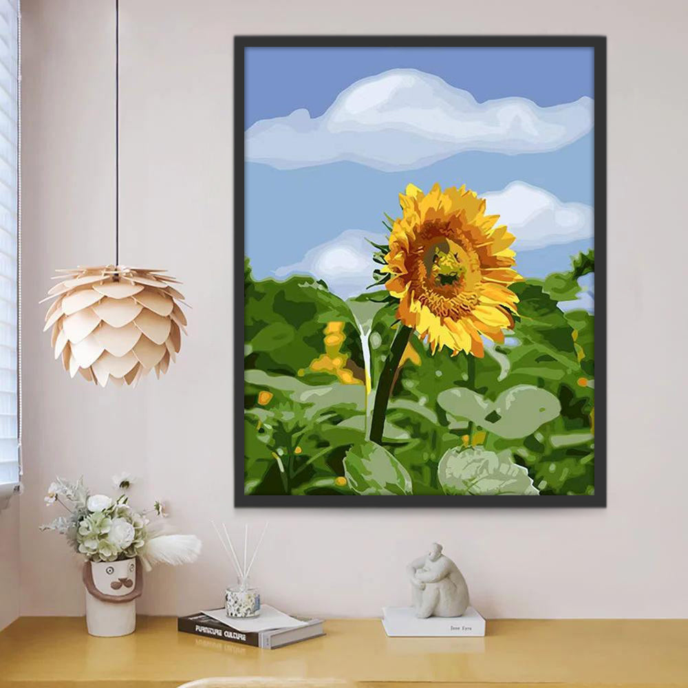 Un Girasol sobre Hojas Verdes con Fondo de Cielo Azul Pintar por Números